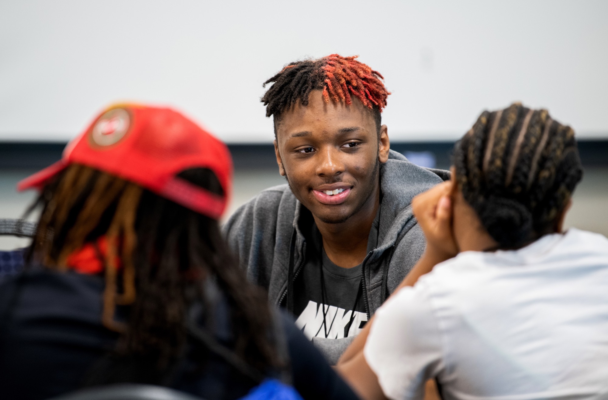 student talking to others during college prep week